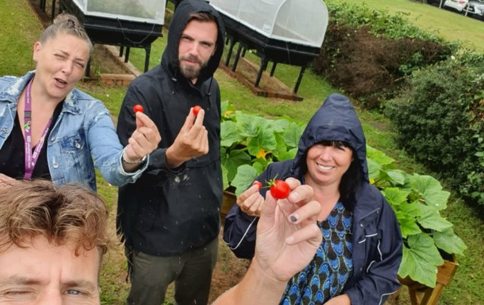 Gardeners show off the food they've grown as part of a project to help mental health and healthy guts